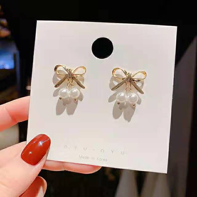 S925 Silver Needle Summer Fresh Mini Pearl Bow Stud Earrings, elegant Korean super fairy-like fashionable and personalized earrings full figure