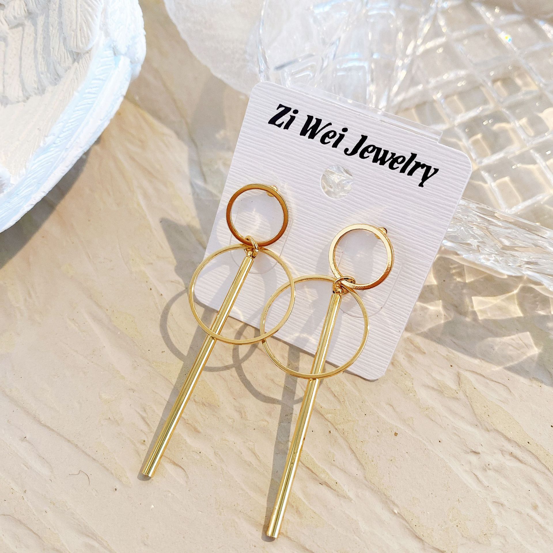 European and American best-selling simple geometric hollowed-out long alloy ear studs with large and small circles, creative golden long tassel ear studs details Picture