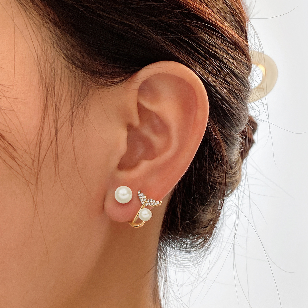 Wholesale of popular micro-inset fish-tail imitation pearl stud earrings on an independent website, with a creative, unique and sweet design sense details Picture