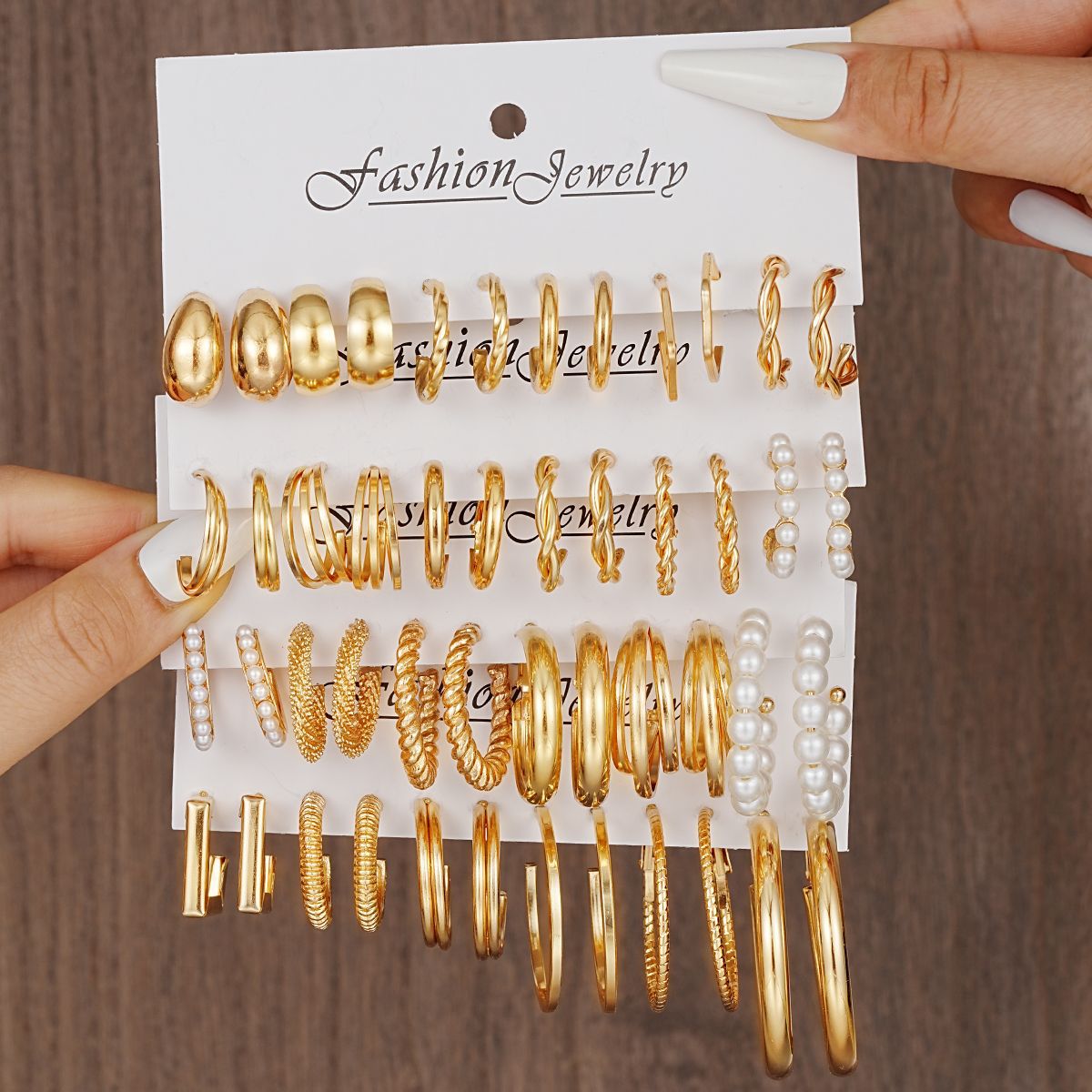 Cross-border best-selling metallic texture C-shaped earrings, creative geometric three-tube imitation pearl twist earrings and earrings set full figure