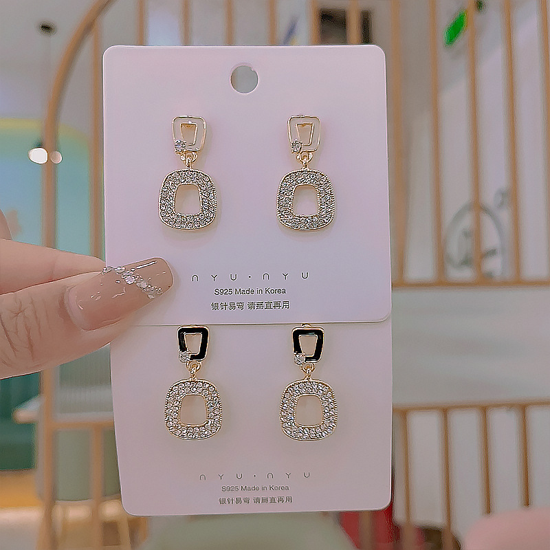 The S925 silver needle personalized hollowed-out geometric micro-set diamond earrings feature a unique and exquisite design, exuding a fashionable and elegant charm full figure