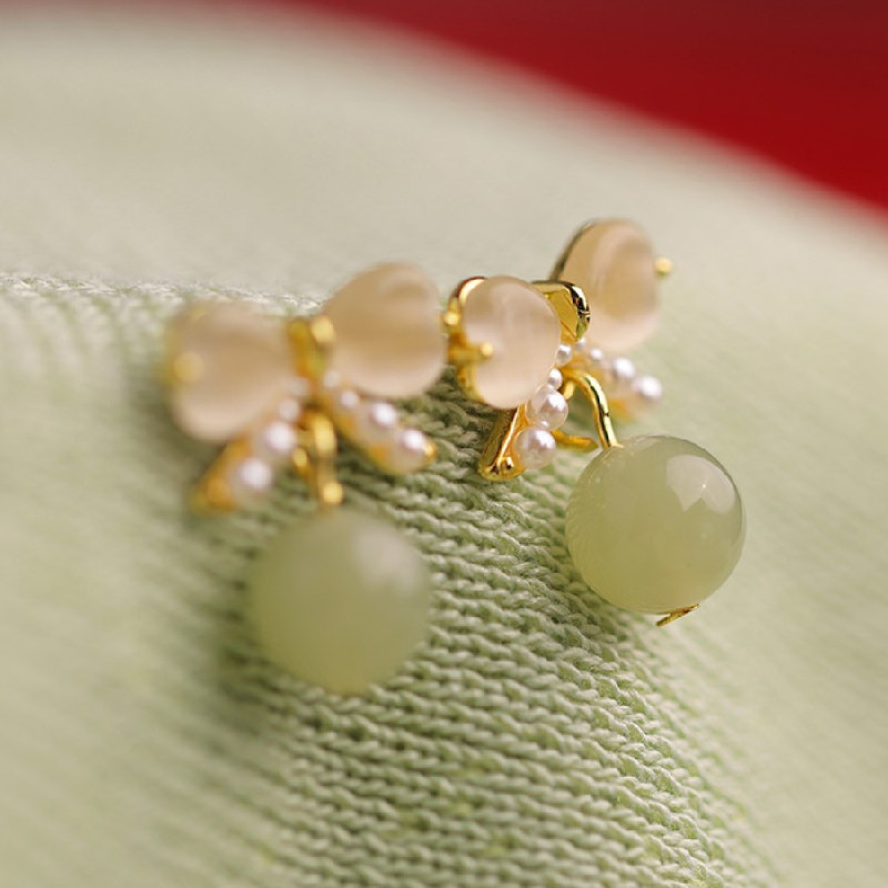 Cat's eye stone ear studs, pearl bow earrings, imitation Hetian jade earrings, niche design, light luxury and high-end sense of earrings for women details Picture
