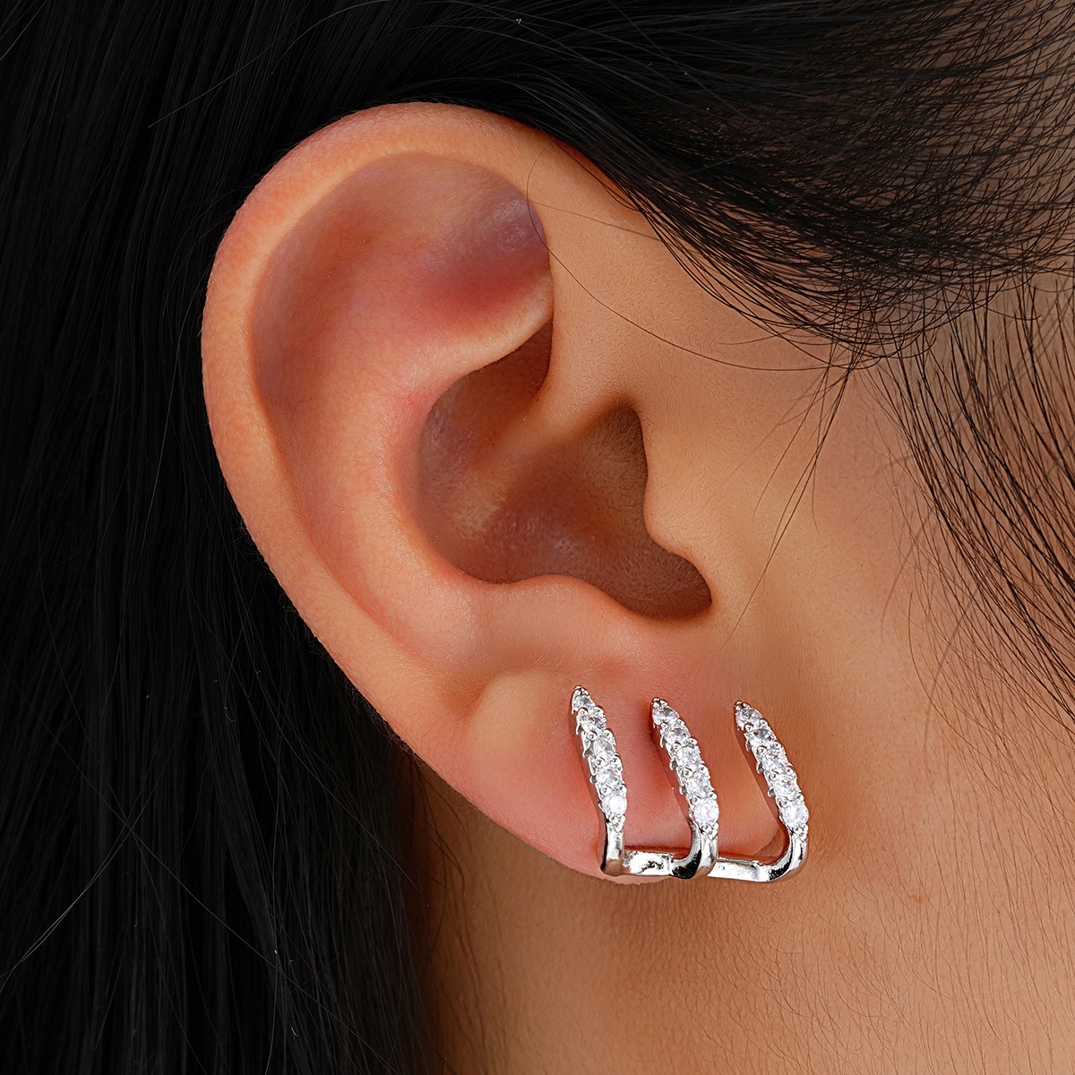 Full-service cross-border creative design sense, niche three-prong diamond-encrusted arc-shaped copper ear studs, wholesale of European and American earrings for women details Picture