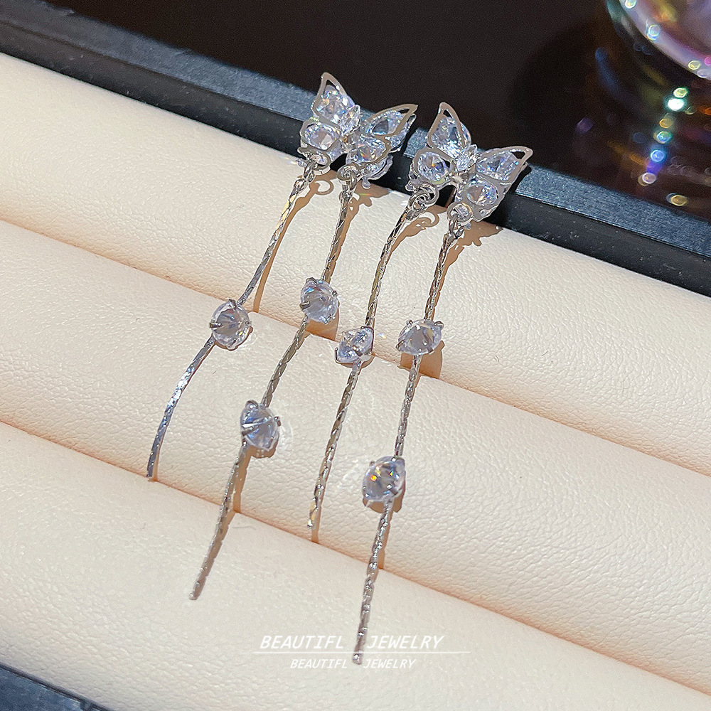 Korean style simple and elegant long tassel earrings, female Internet celebrity style light luxury bow earrings, exquisite and individual earrings Application Scenario