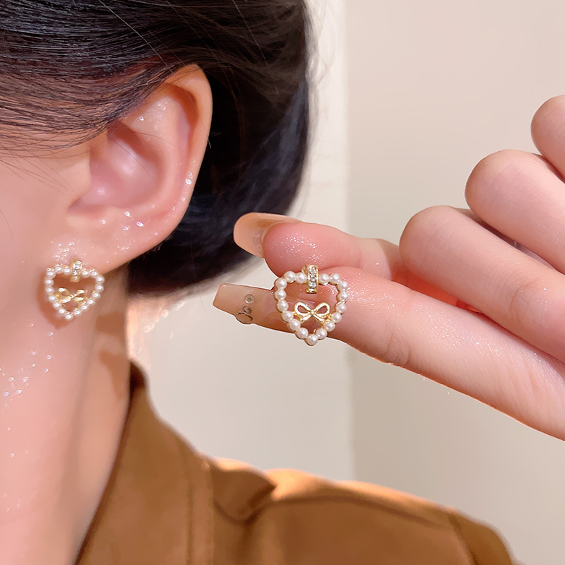 925 Silver needle hollowed-out heart-shaped bow pearl earrings, versatile for ladies, fresh, sweet and cute stud accessories details Picture