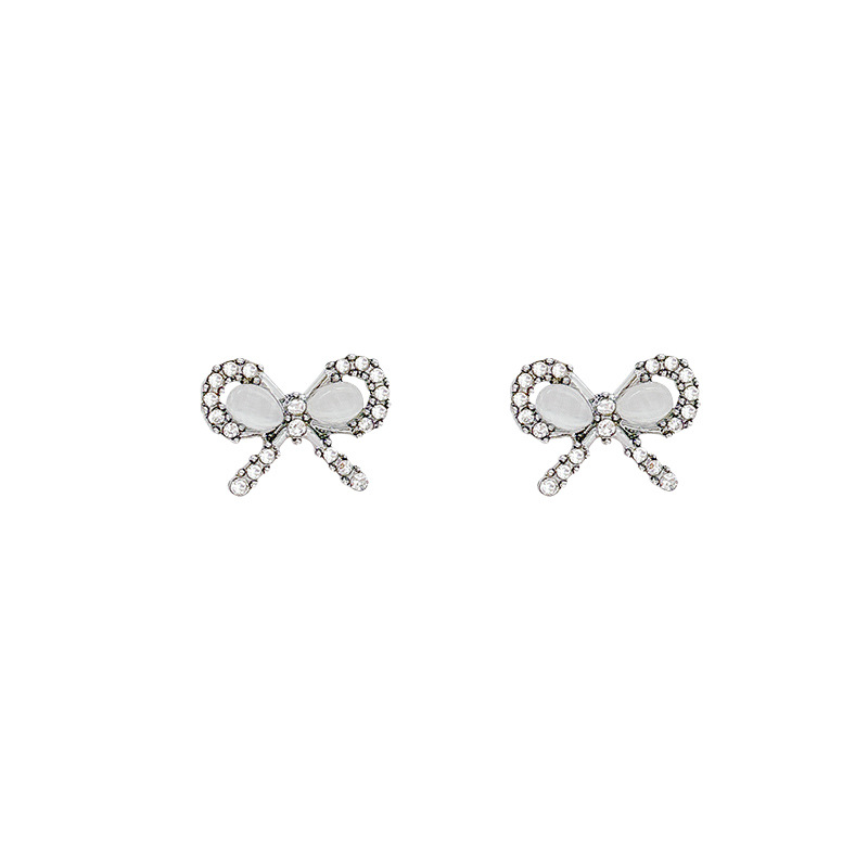 Zirconium-encrusted cat's eye stone bow earrings for women, a light luxury, niche and high-end look. Small, exquisite and unique accessories Item Picture
