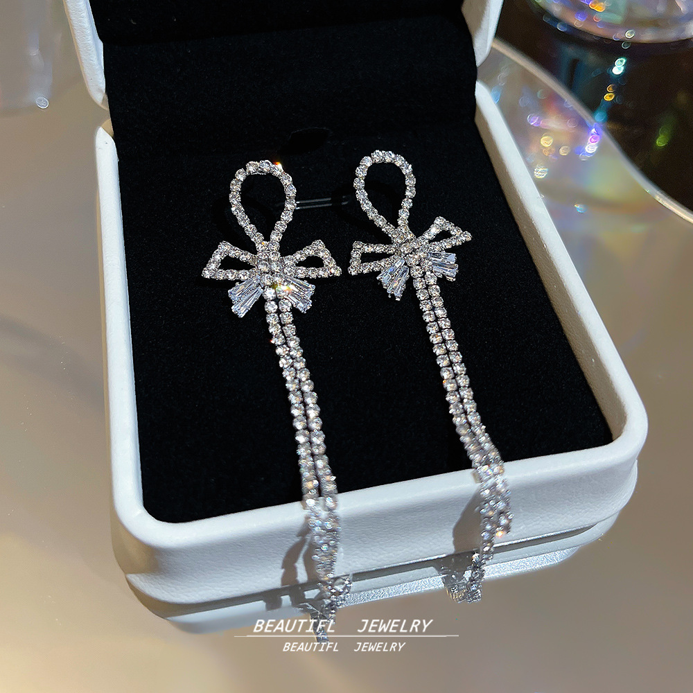 Korean-style, niche, sweet and versatile earrings with a light luxury and high-end feel. Long stud earrings with full diamonds, tassels and bows details Picture