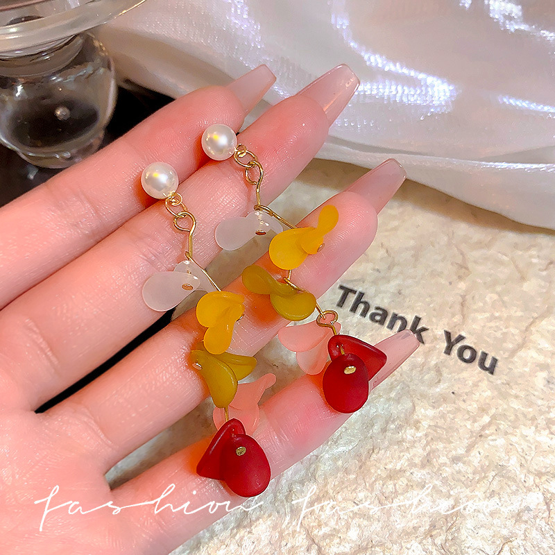 Ethereal tassel petal pearl earrings, high-end and light luxury style, long round face slimming, vacation earrings for women full figure