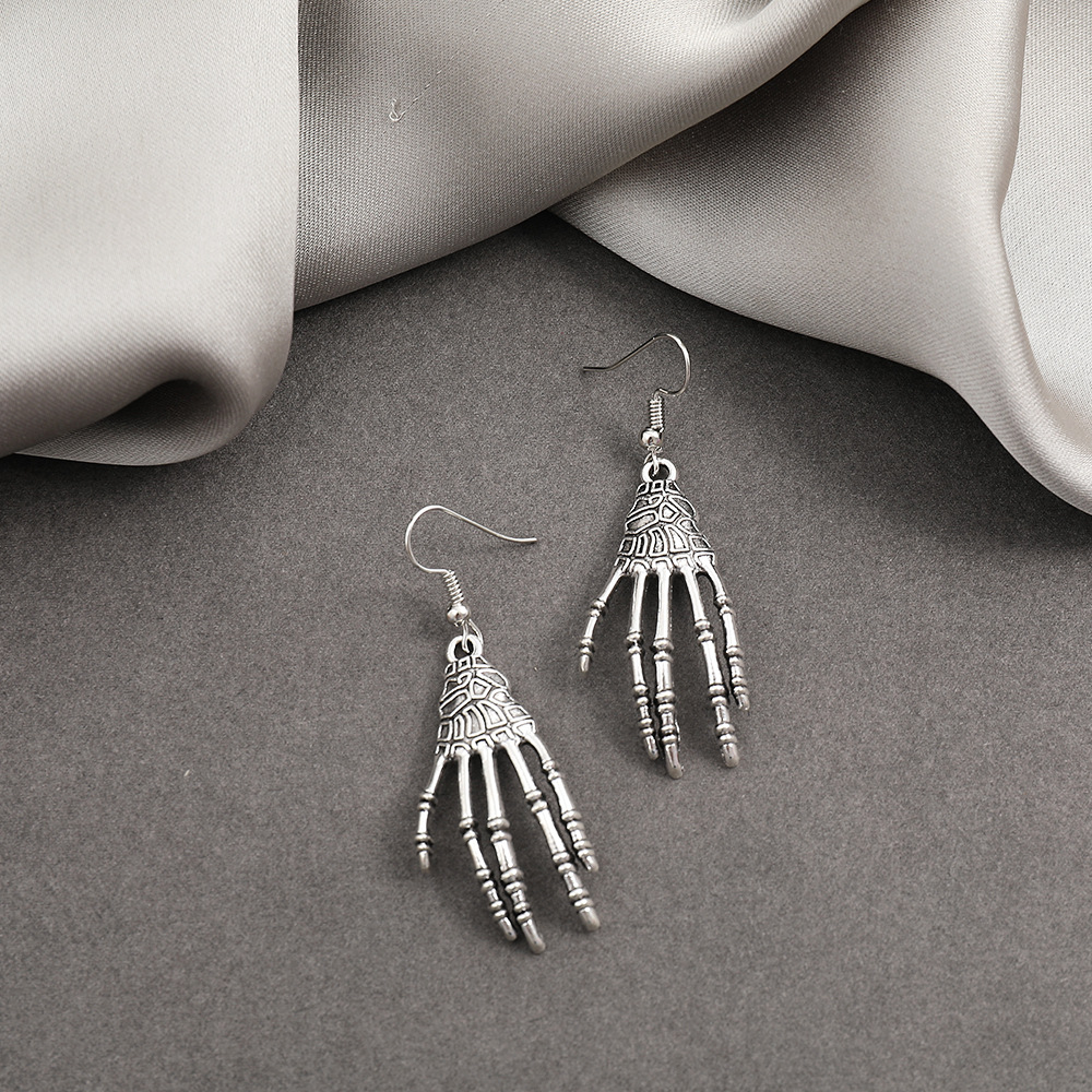 Creative Halloween-themed stud earrings, personalized alloy festival ear hooks, exaggerated horror ghost skull palm earrings Application Scenario