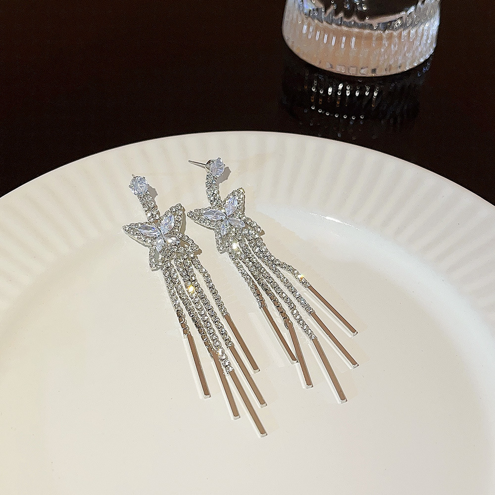 925 Silver needle European and American exaggerated diamond-encrusted butterfly tassel earrings, ins high-end, fashionable and stylish, trendy and unique earrings Application Scenario