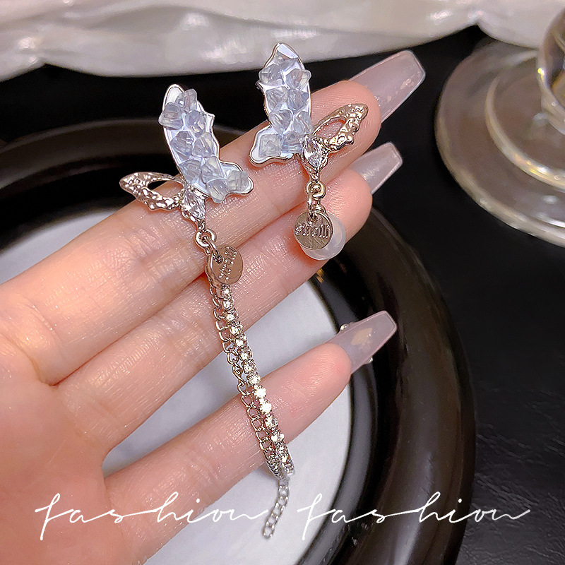 Asymmetrical butterfly crystal pearl tassel earrings, high-end and elegant new earrings S925 silver needle stud earrings for women full figure
