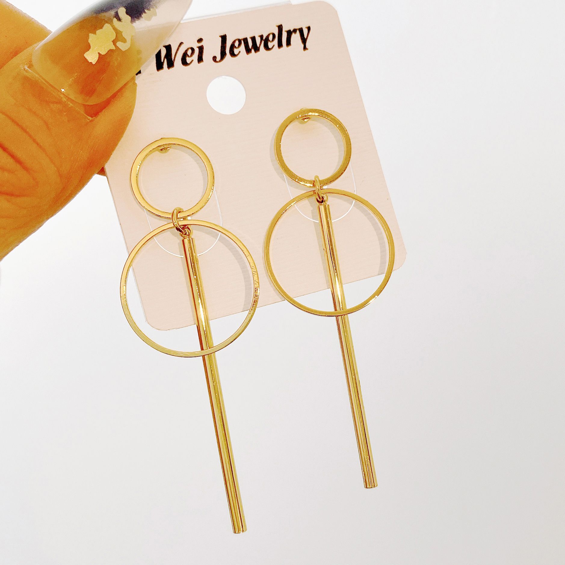 European and American best-selling simple geometric hollowed-out long alloy ear studs with large and small circles, creative golden long tassel ear studs full figure