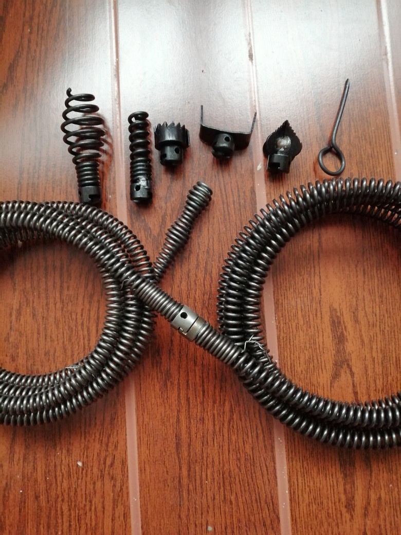 A household sewer unclogging tool, a hand drill, 12mm spring for unclogging pipes undefined