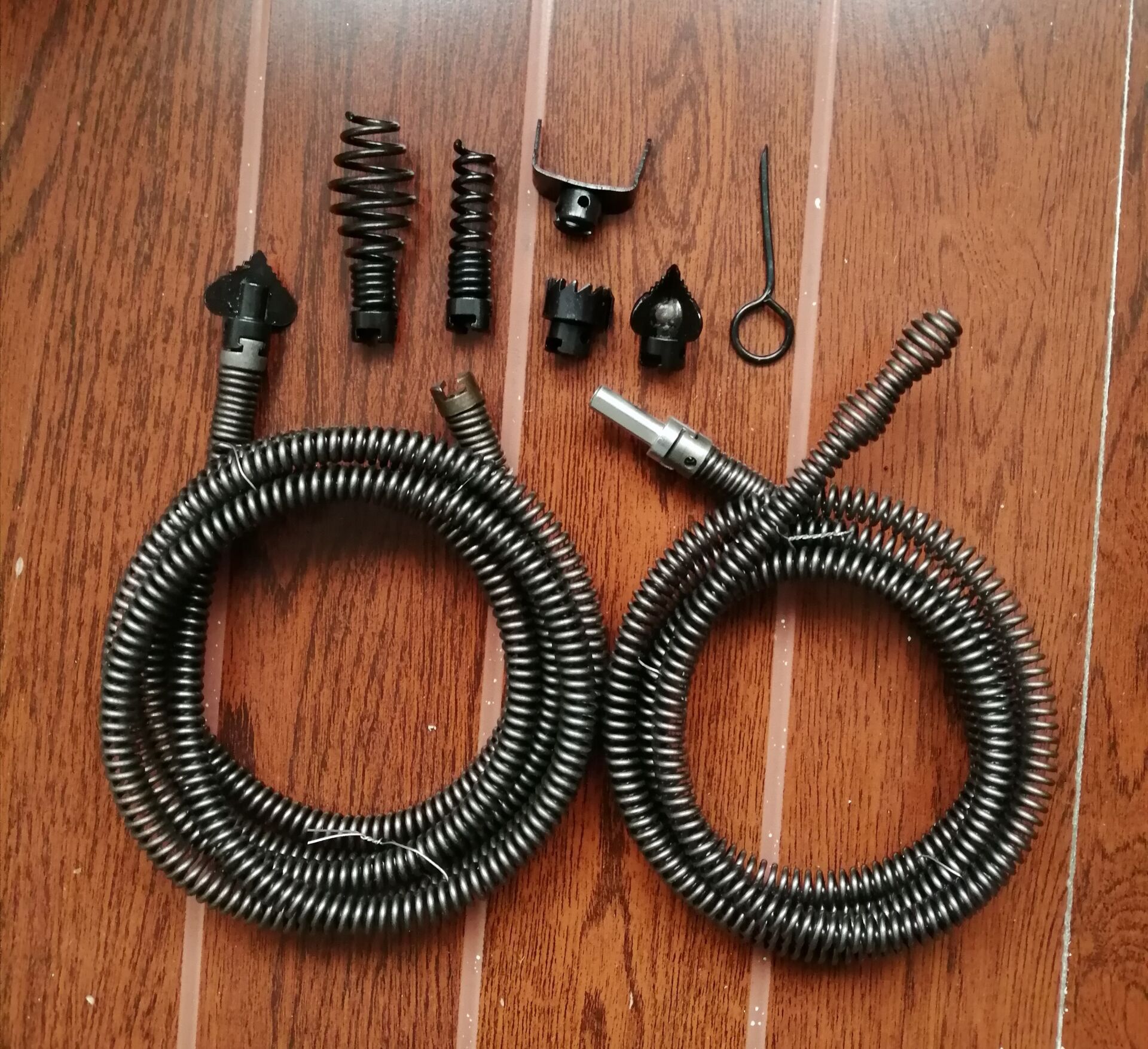 A household sewer unclogging tool, a hand drill, 12mm spring for unclogging pipes full figure