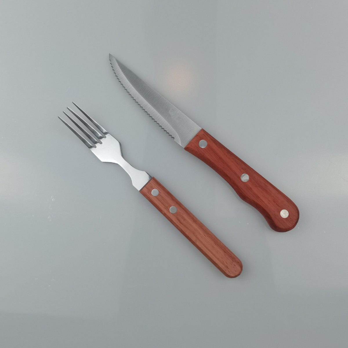 Cross-border best-selling stainless steel wooden-handled steak knife set, hotel Western cuisine steak knife, serrated steak knife details Picture