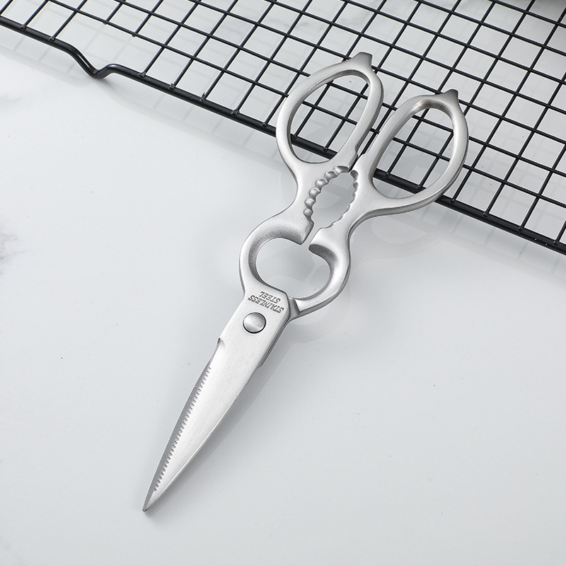The all-stainless steel multi-functional gourd-shaped scissors for the kitchen are non-detachable and can be used to pick up walnuts and chicken bones. They are household scissors Application Scenario