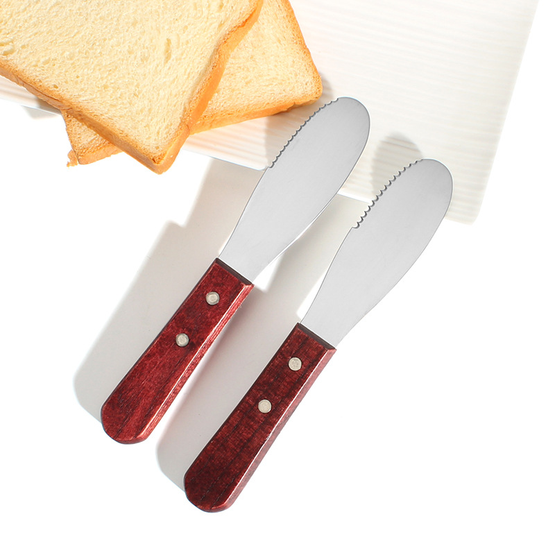 In stock: Stainless steel, wooden-handled, serrated cheese knife, cheese knife, butter scraper with a smooth texture, cheese knife full figure
