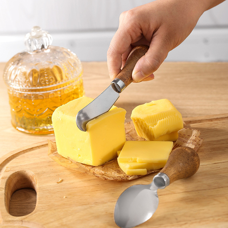 Creative kitchen gadgets: Wooden muddle, cheese and cheese knife, butter spatula, potato muddle, knife and fork set details Picture