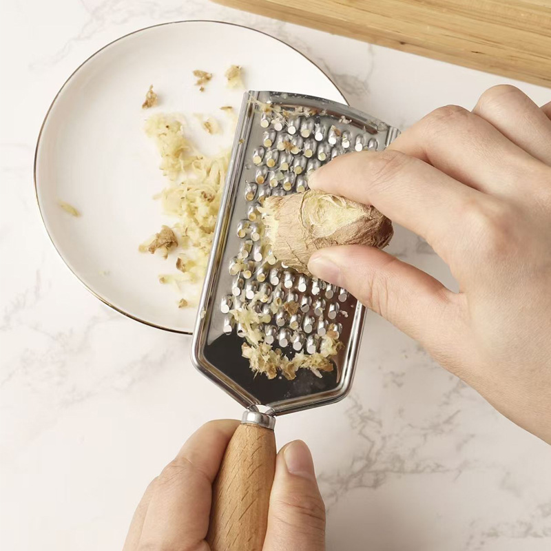 Stainless steel multi-functional grater, household potato and fruit and vegetable slicer, grater, kitchen vegetable slicing and shred magic tool Application Scenario