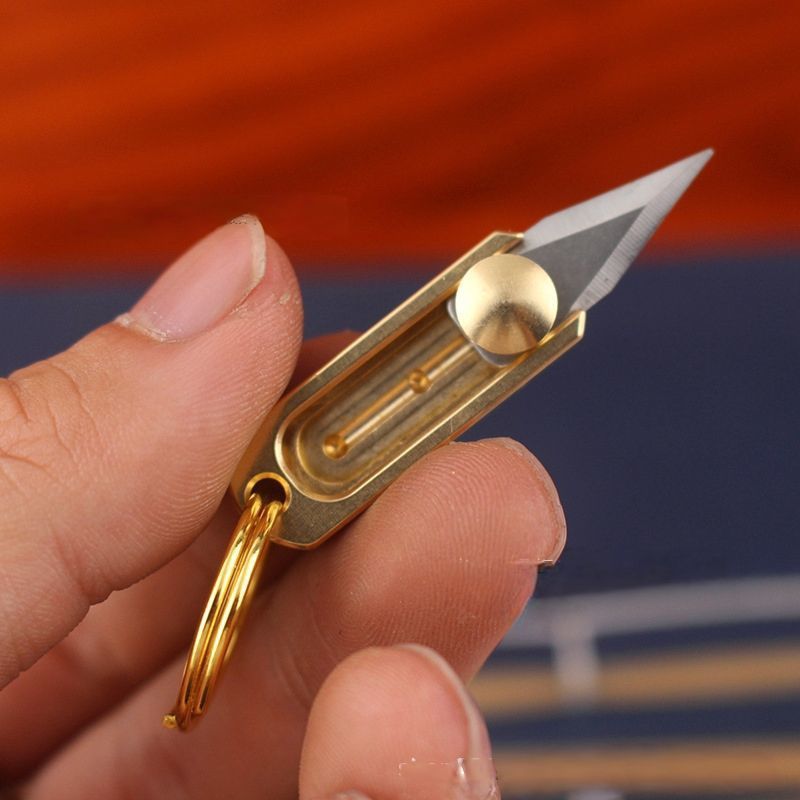 Portable keychain pendant, unpacking packages, opening boxes, small brass mini knife, sharp pocket, push-pull details Picture