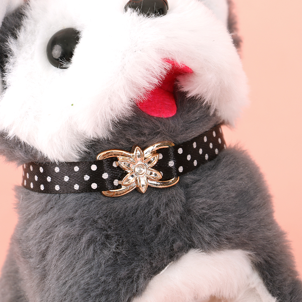 An electric plush dog with a collar, singing while posing, and playing cute while picking up toys for interaction Item Picture