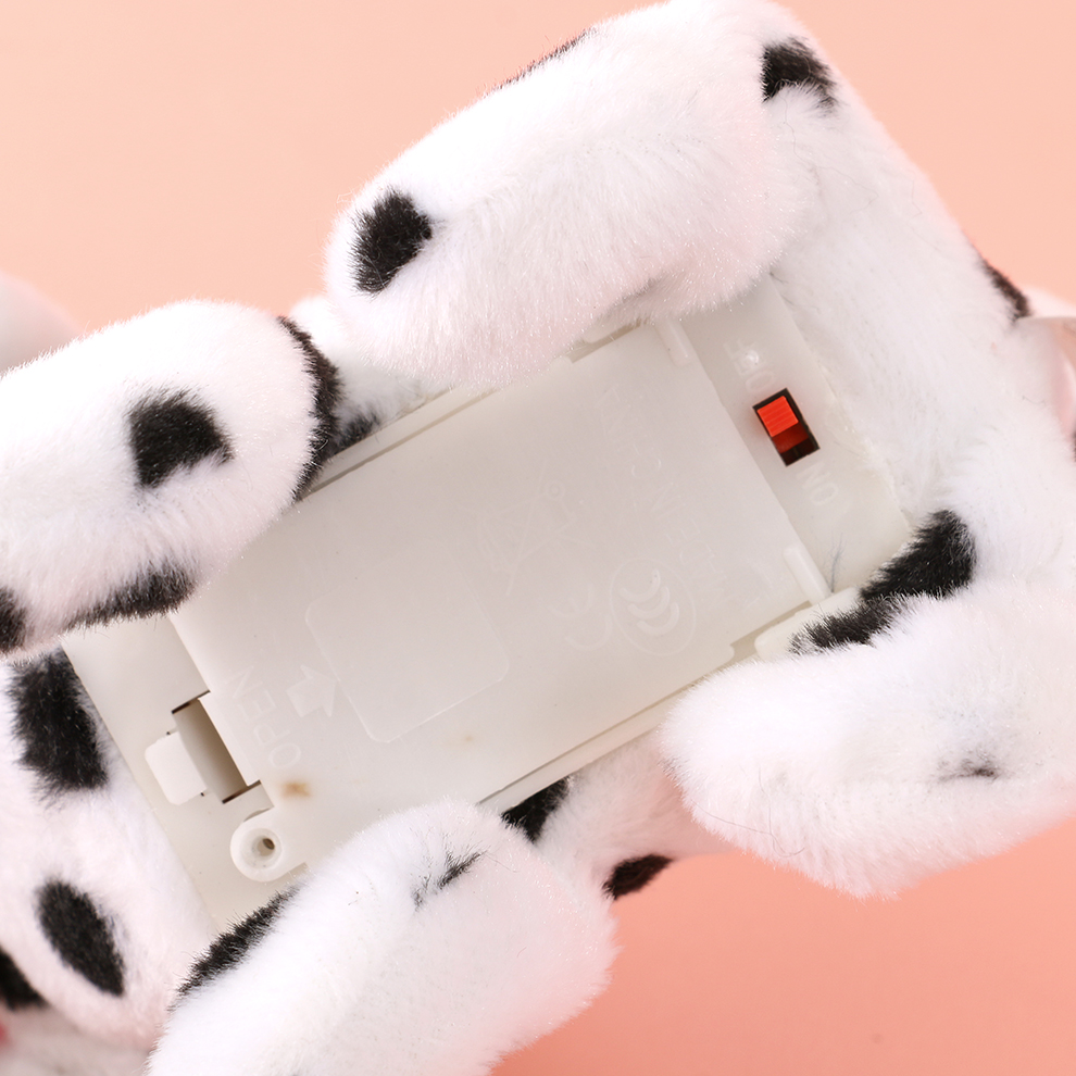 A black and white electric plush dog with spots. It responds by calling its name and singing. The call dialogue is recorded and it rings the bell to respond when being cute Item Picture