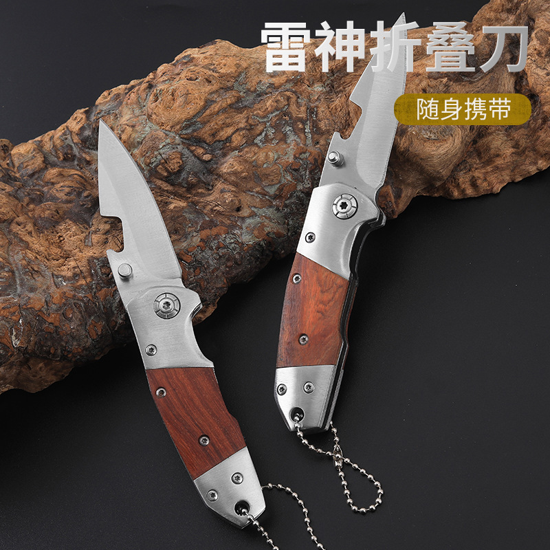The shopkeeper recommends the outdoor high-hardness life-saving folding knife, a small self-defense knife for the wild with a redwood handle, and a sharp portable knife details Picture