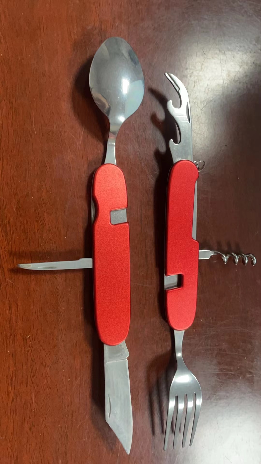 A variety of portable foldable and storable stainless steel knives, forks, spoons, outdoor multi-purpose camping tableware and creative picnic tools undefined