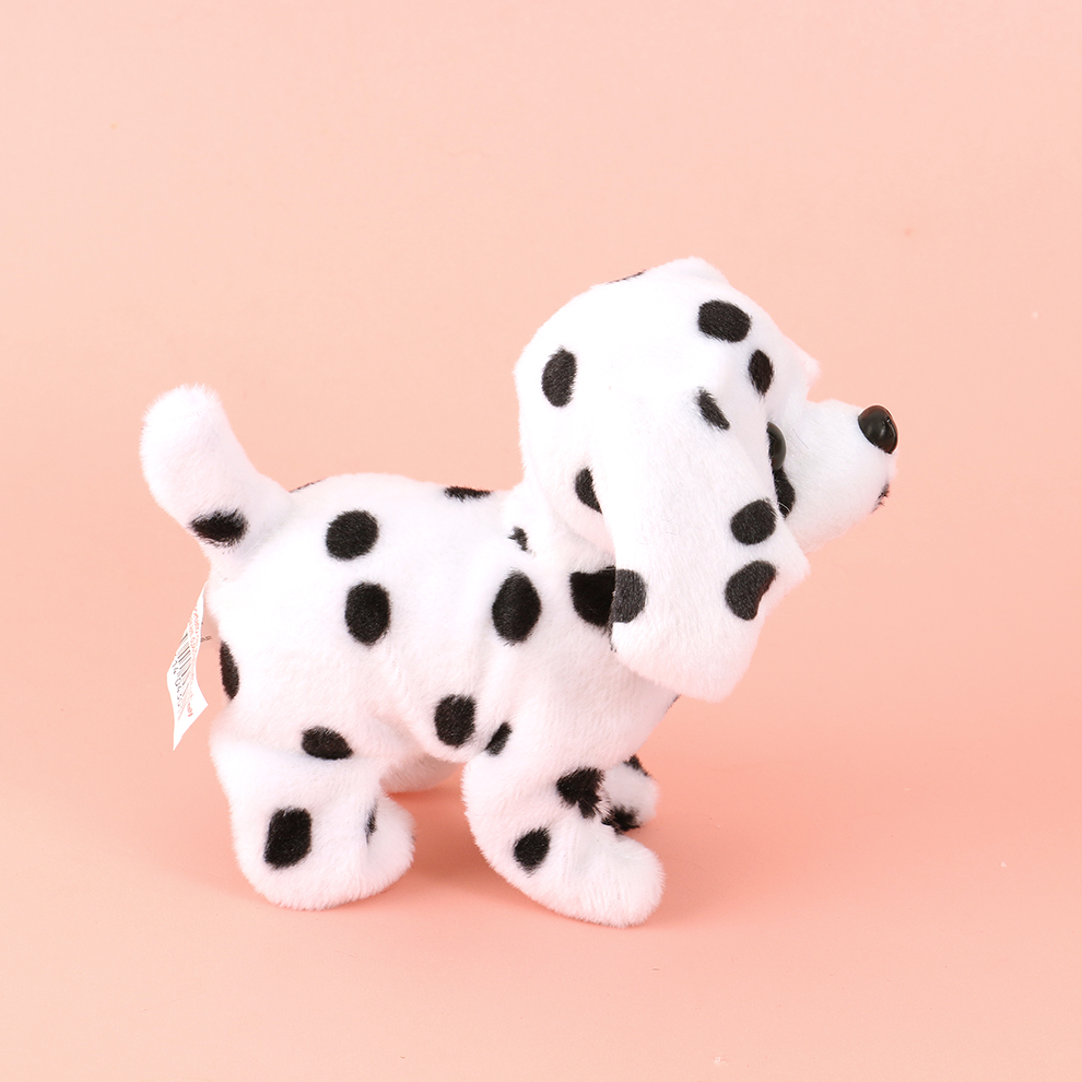 A black and white electric plush dog with spots. It responds by calling its name and singing. The call dialogue is recorded and it rings the bell to respond when being cute