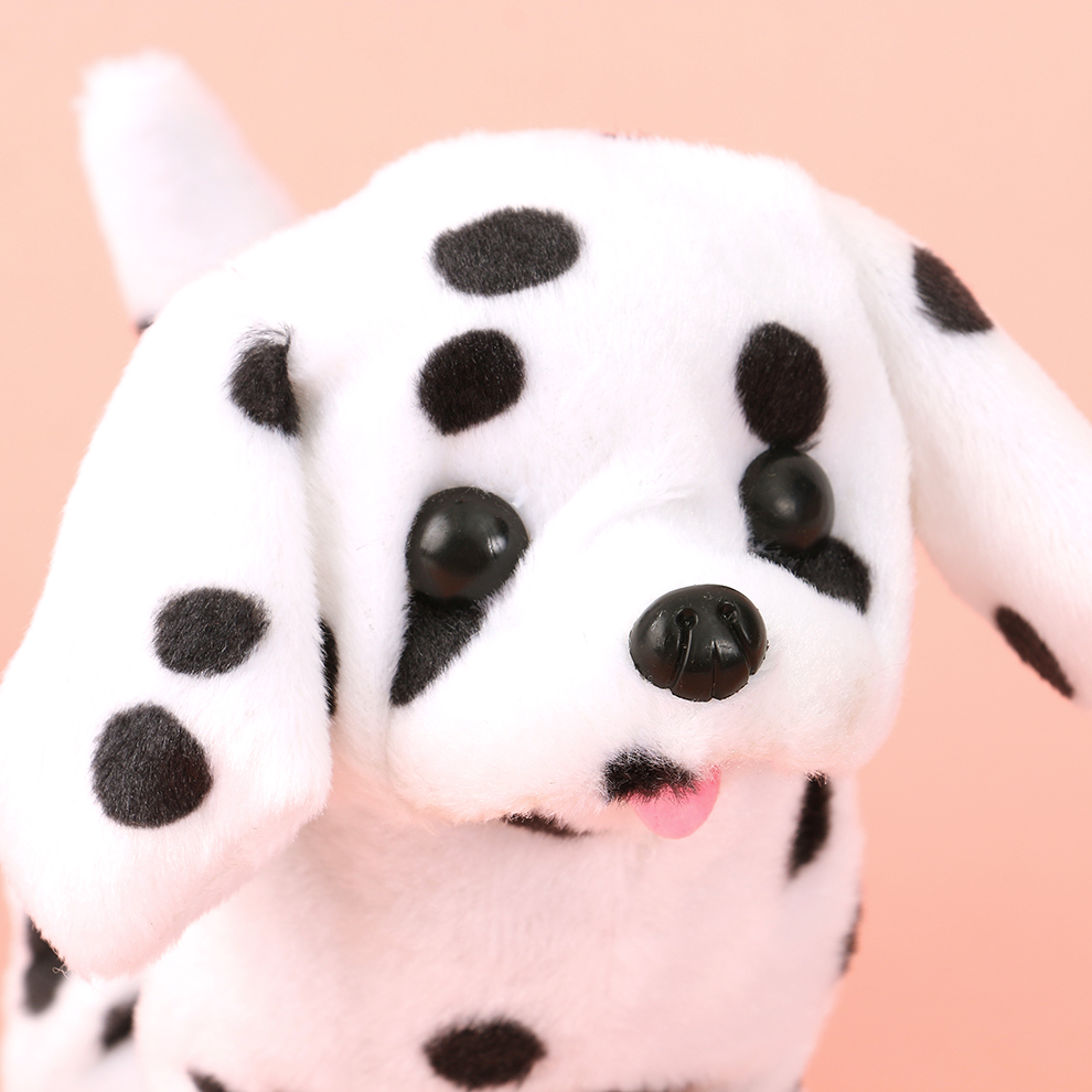 A black and white electric plush dog with spots. It responds by calling its name and singing. The call dialogue is recorded and it rings the bell to respond when being cute Specification image