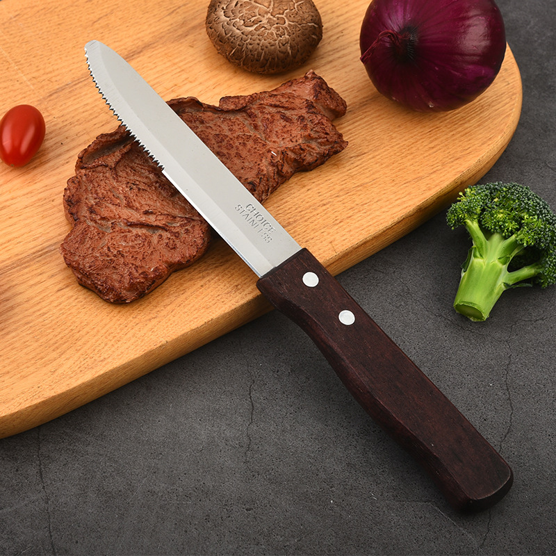 Factory wholesale stainless steel kitchenware and tableware, wooden handle serrated beef and mutton cutlet knives, household barbecue and bread knives, Western cuisine knives full figure