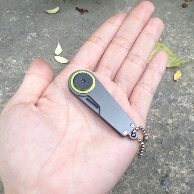Outdoor portable keychain knife EDC portable multi-functional tool 3cm folding survival zipper hook knife Application Scenario
