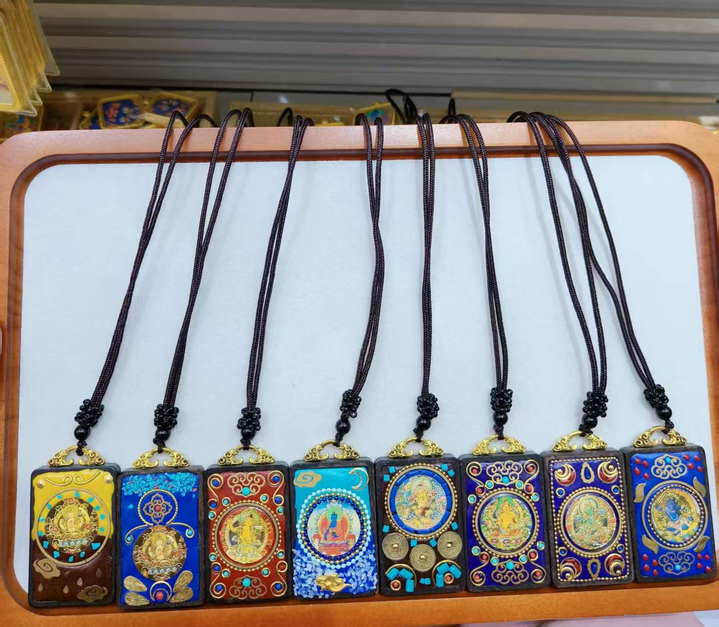 Handcrafted Indonesian Thangka necklaces made of sandalwood and clay, such as peace, good fortune, wealth, money tree, Zakiram, Yellow God of Wealth, Green Tara, etc details Picture
