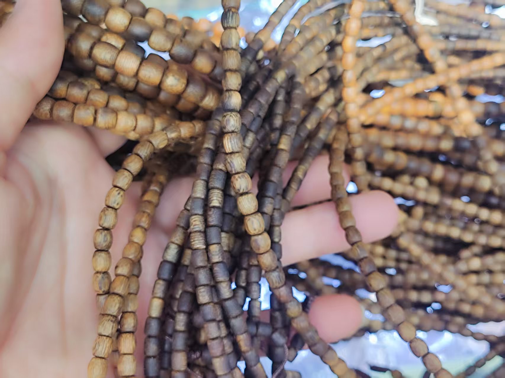 Long strings of bucket beads of green Phoebe wood from Yingge, Hainan detail image 5