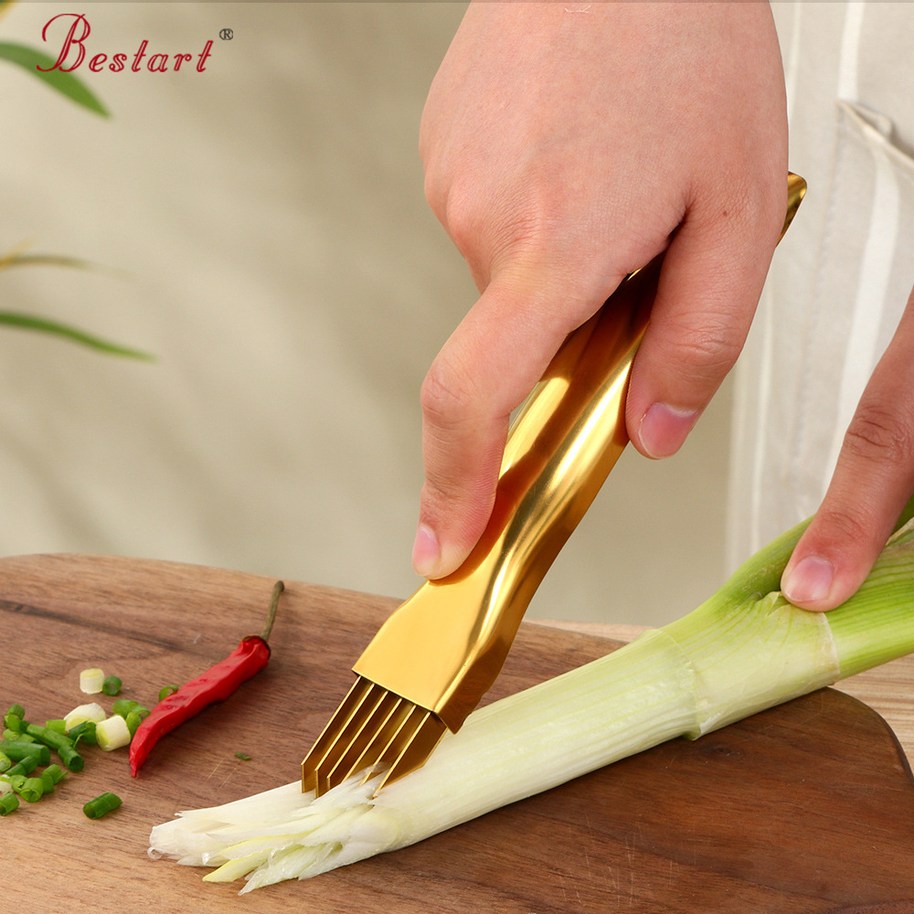 A portable and lightweight golden kitchen tool for catering and household use, a stainless steel scallion cutter with logo for shredding scallions and garlic sprouts full figure
