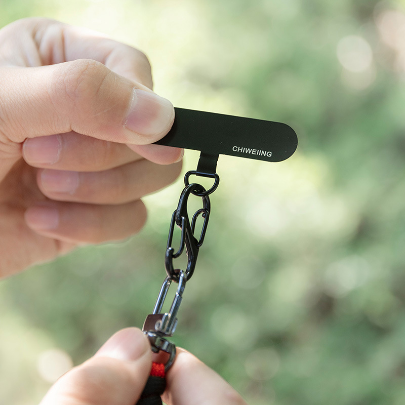 Stainless steel mobile phone lanyard patch on the back of the casing, universal mobile phone neck lanyard clip piece anti-loss gasket manufacturer, black Application Scenario