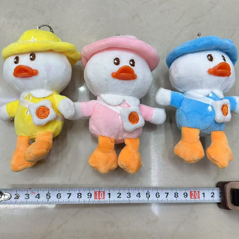 Hat wearing, schoolbag carrying, anthropomorphic duck, plush toy, creative doll, cartoon peripheral pendant, plush doll pendant, keychain, cloth doll pendant, cute decoration gift, claw machine factory direct sales Specification image