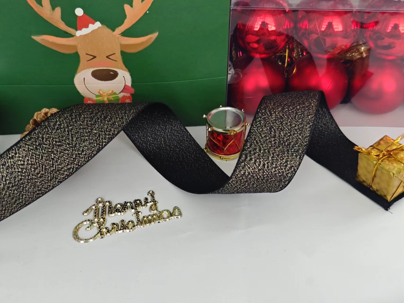 Item No. : 1273 Christmas Gift Packaging Decoration DIY Black Gold Scallion Shiny Christmas Webbing 3.8cm Item No. : 1273 Christmas Gift Packaging Decoration DIY Black Gold Scallion Shiny Christmas Webbing 3.8cm
