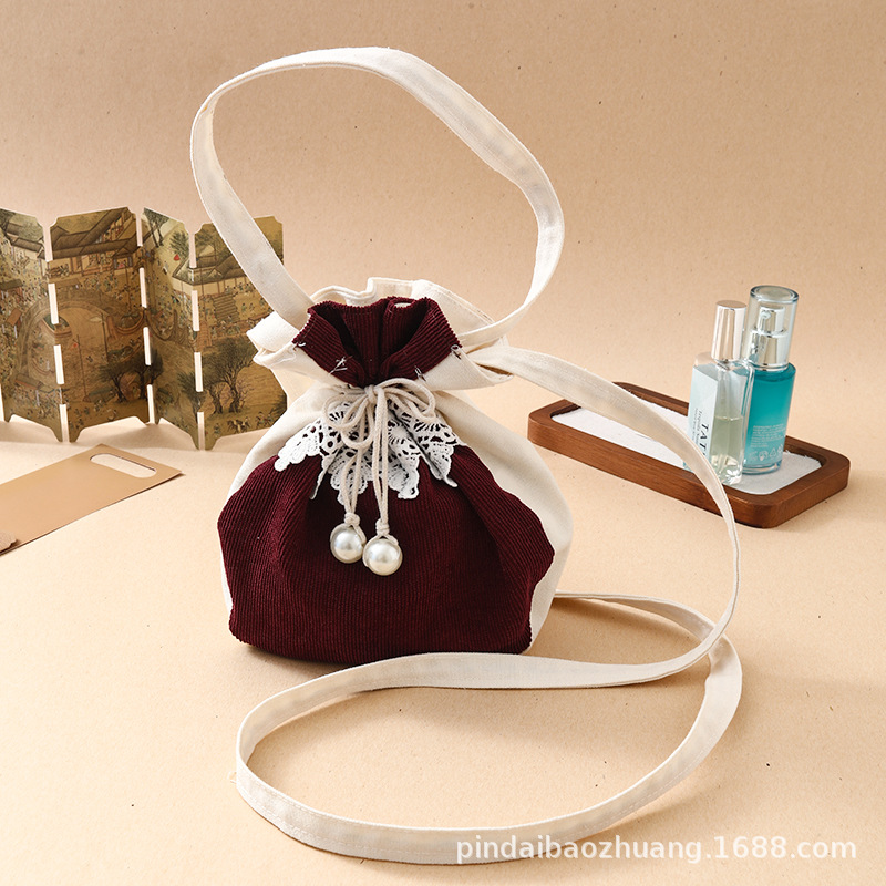 新款斜挎包源头工厂现货休闲民族风化妆包百搭灯芯绒棉布束口包详情图2