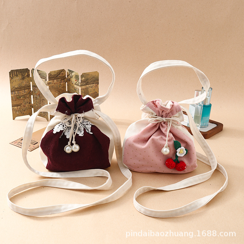 新款斜挎包源头工厂现货休闲民族风化妆包百搭灯芯绒棉布束口包详情图4