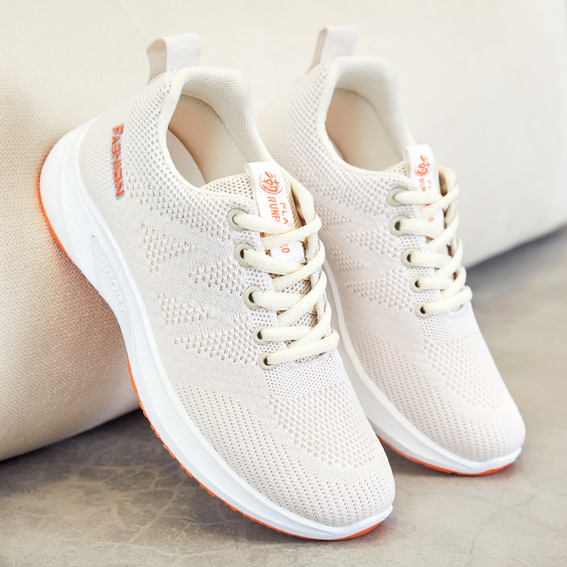 Spring new breathable flying mesh running shoes for women, wholesale from the manufacturer. Flat, lightweight and soft-soled sports shoes for women full figure