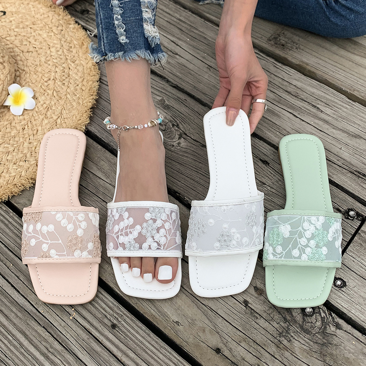 This 2025 new style of flat slippers for women's summer wear, featuring a comfortable square toe and elegant one-shoulder style with a mesh and floral design full figure