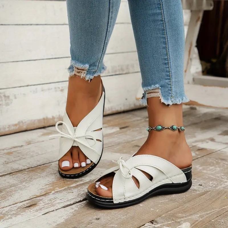 Cross-border trade large-sized bow wedge heel flat sandals 2025 new solid color fish-mouth hollowed-out hole shoes Application Scenario