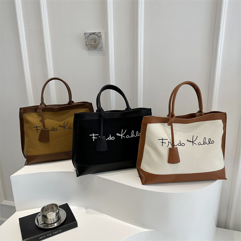 European and American large-capacity fashionable printed letter 2025 Spring new retro artistic and individualistic single-shoulder tote handbag for women full figure
