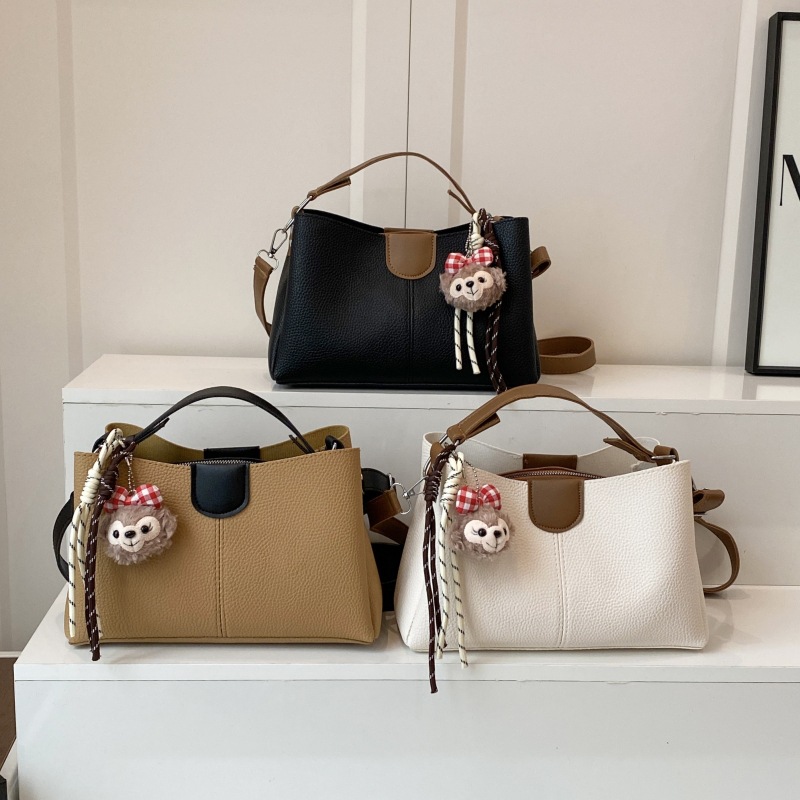 2025 New color-blocking casual hand-held women's bag, large-capacity multi-layer bucket bag, simple single-shoulder crossbody women's bag full figure