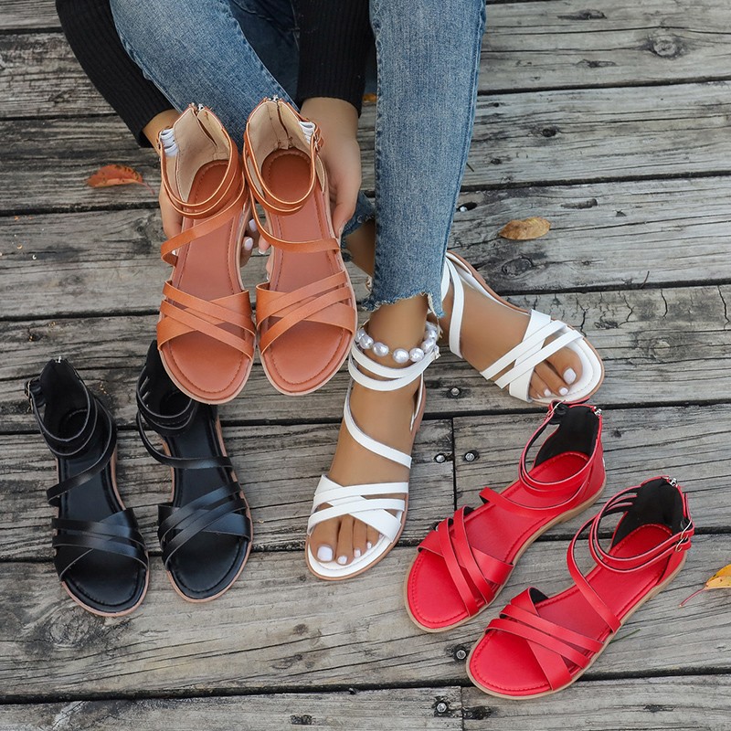 2024 New summer flat shoes with hollowed-out crossed open-toe sandals for women, Roman-style flat beach sandals for going out full figure