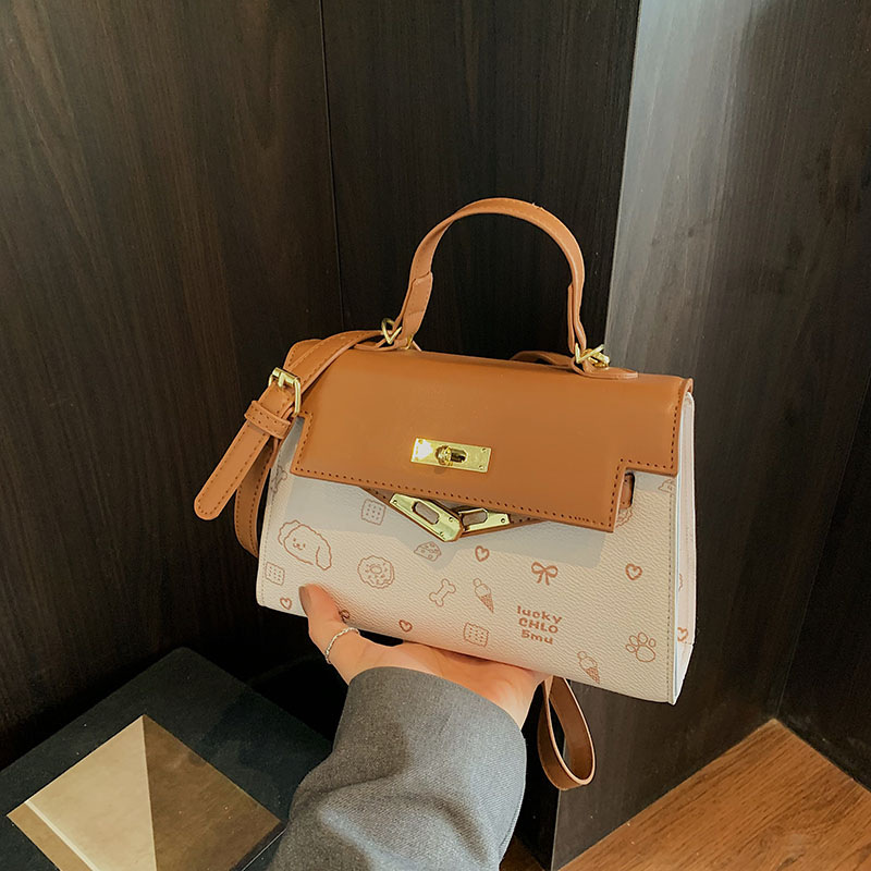 The popular and versatile Kelly handbag for women in the spring of 2025 is a simple and fashionable single-shoulder crossbody bag with contrasting colors details Picture