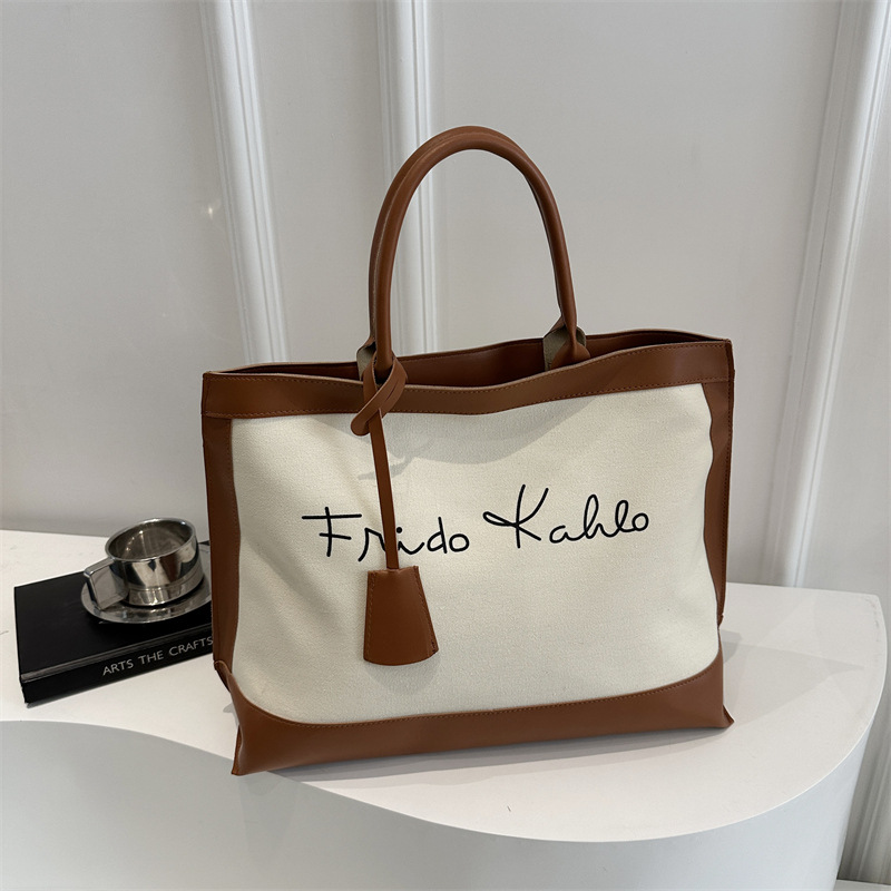 European and American large-capacity fashionable printed letter 2025 Spring new retro artistic and individualistic single-shoulder tote handbag for women details Picture