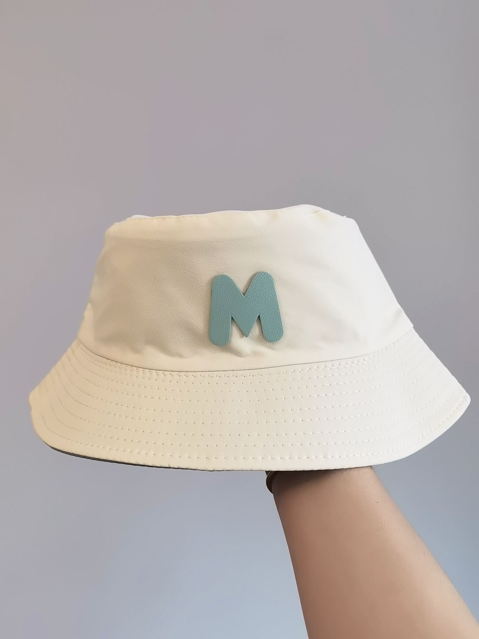 This spring and summer Korean bestseller features a double-sided fisherman's hat with the letter "M" logo. It can provide sun protection and is simple, fashionable, versatile, foldable and easy to carry. It is suitable for both men and women, and is available in size 58 for adults Specification drawing