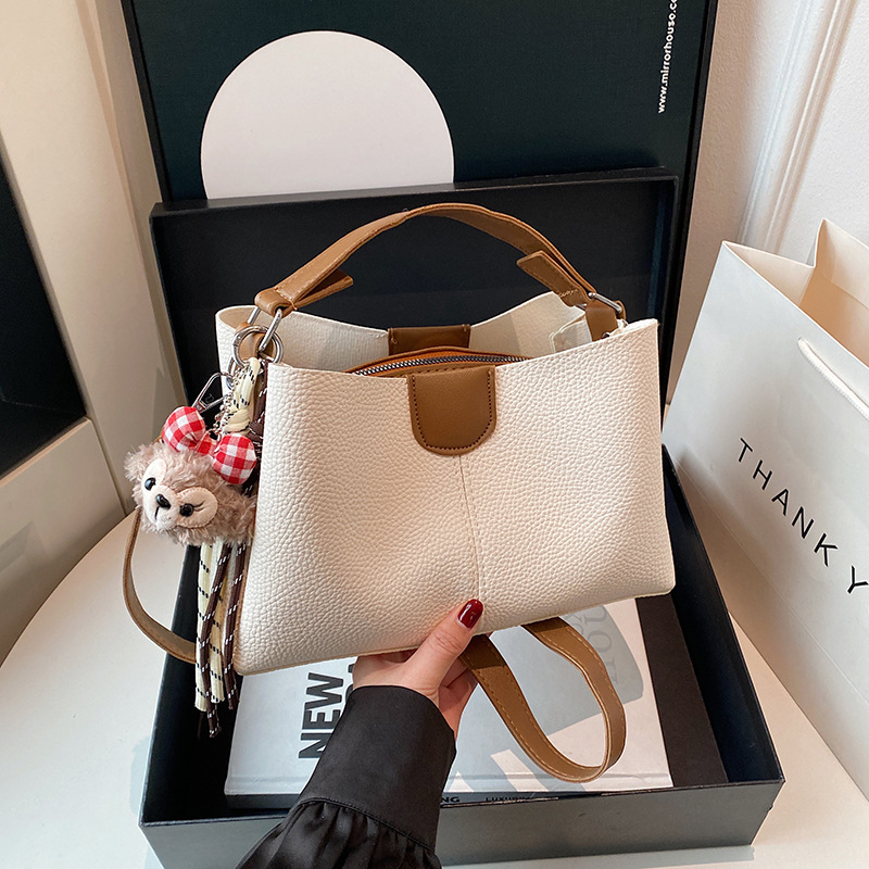 2025 New color-blocking casual hand-held women's bag, large-capacity multi-layer bucket bag, simple single-shoulder crossbody women's bag details Picture